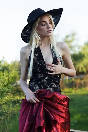 Skinny blonde Kira shows her small boobs and tight ass outdoor