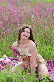 Carrie Rides Up To Expose Her Sexy Booty When She Stretches Out On A Blanket