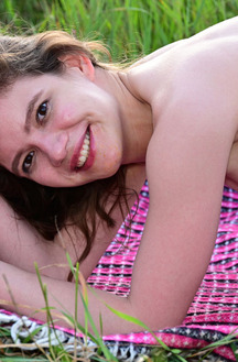 Carrie Rides Up To Expose Her Sexy Booty When She Stretches Out On A Blanket