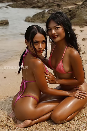 Watch lustful lesbian couple Namy Asian and Lilly playing in the beach sand