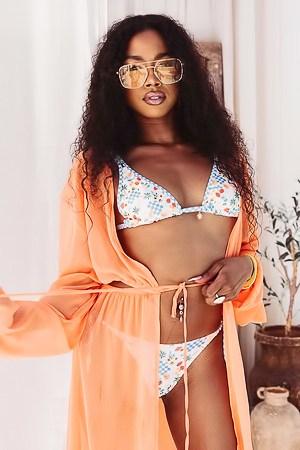 Mia Love drops a bikini, showcasing her natural curves and brown beauty
