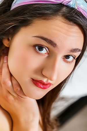 Luscious Adeline grabs and teases her full breasts